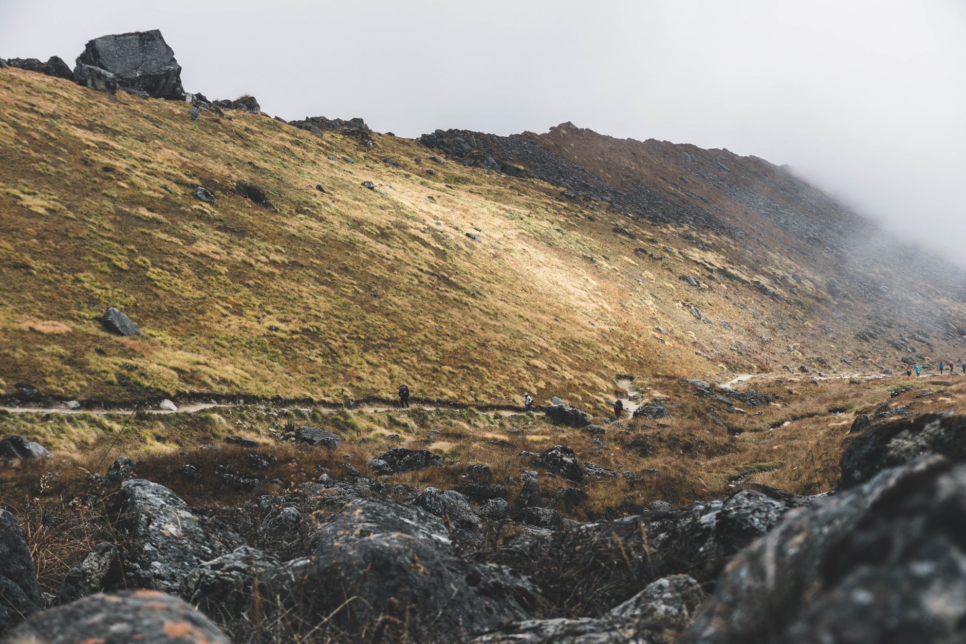 Sunlight piercing through alpine mountain pass