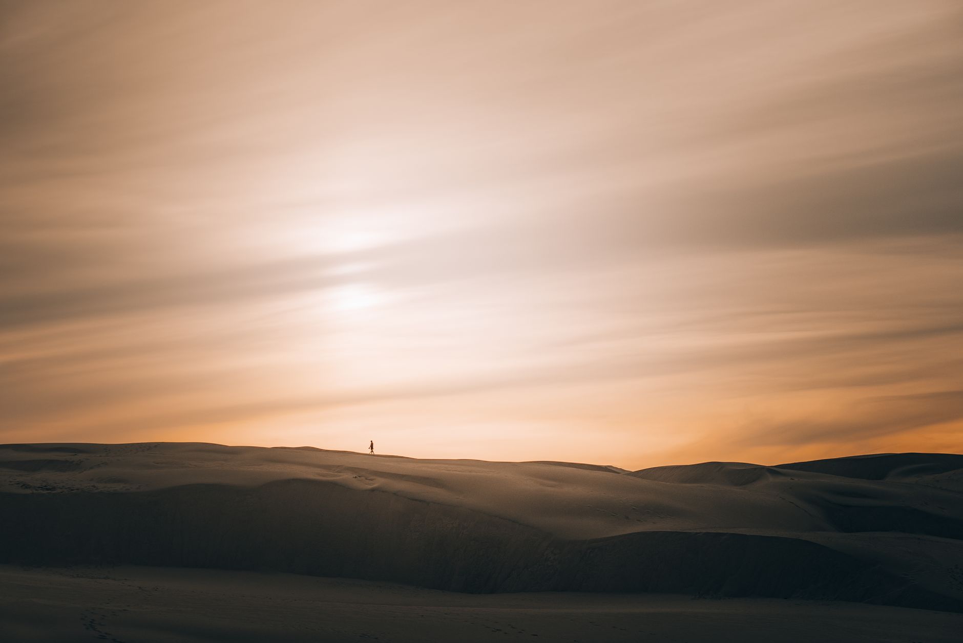 Desert sand dunes and quiet sky